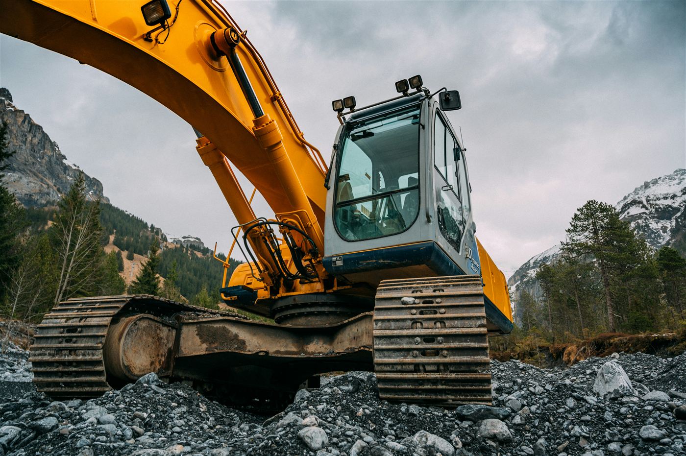 Excavation equipment working near rocky ground